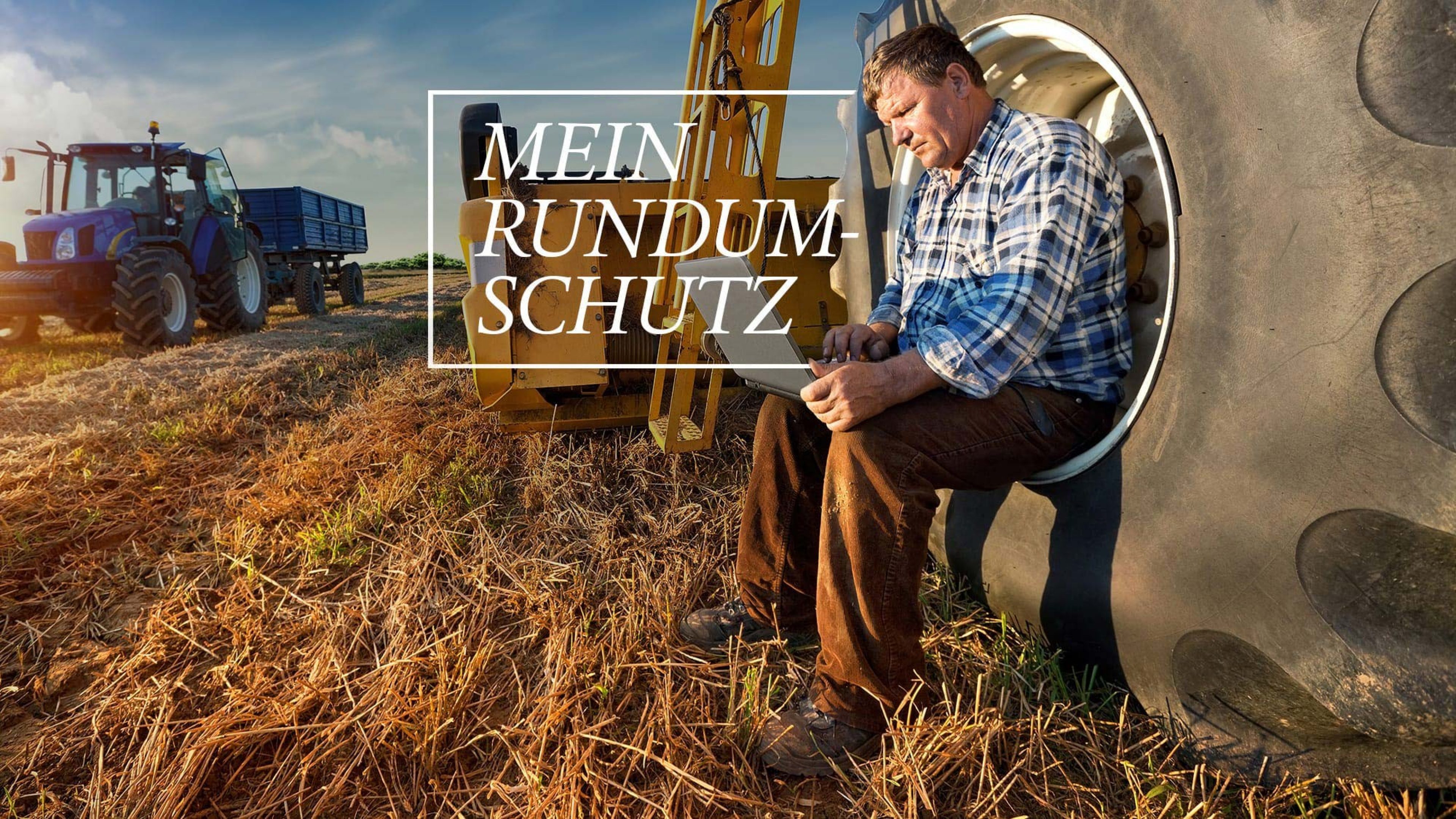 Landwirt mit Laptop auf Feld